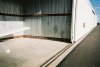 Piper finds shade in hangar.jpg