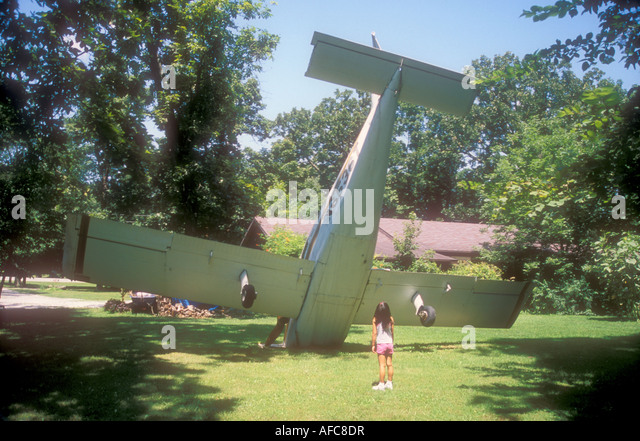 crashed-airplane-as-a-joke-in-a-residential-yard-afc8dr.jpg