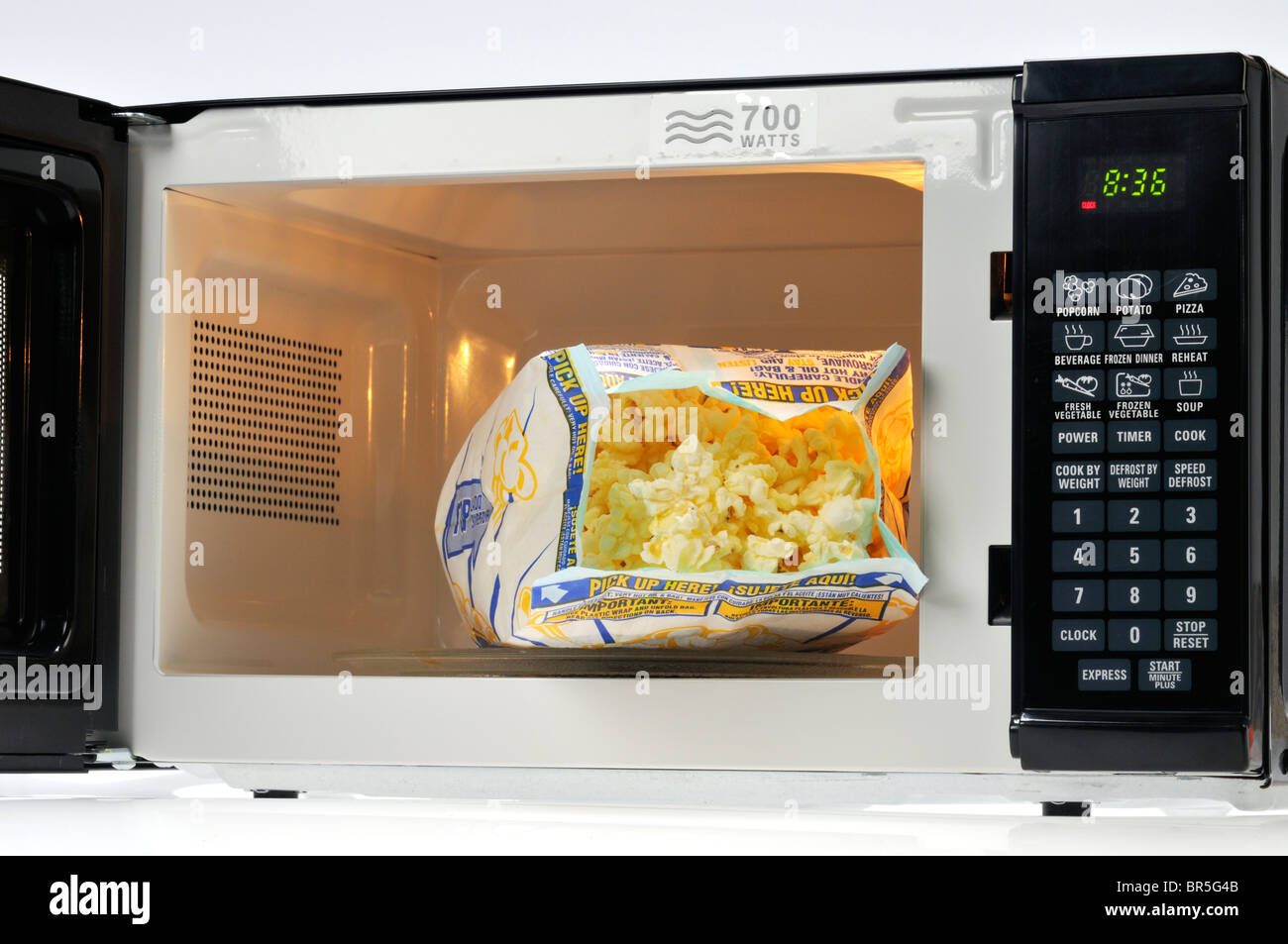open-bag-of-pop-secret-microwave-popcorn-in-microwave-oven-usa-BR5G4B.jpg
