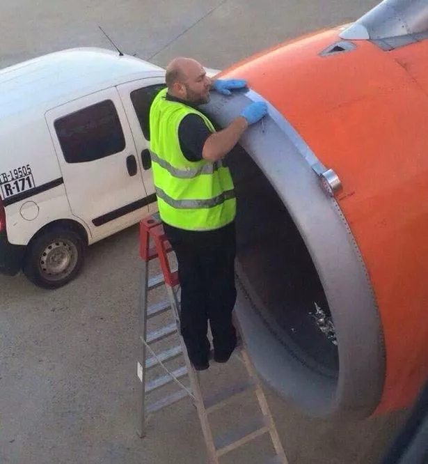 Photo-of-airport-worker-using-TAPE-on-engine-shell-of-easyJet-plane-moments-before-take-off.jpg
