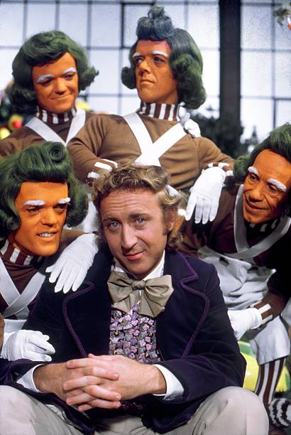 willi-wonka-with-his-oompa-loompa-workers-in-a-publicity-still-for-the-1971-movie-willie-wonka.jpg