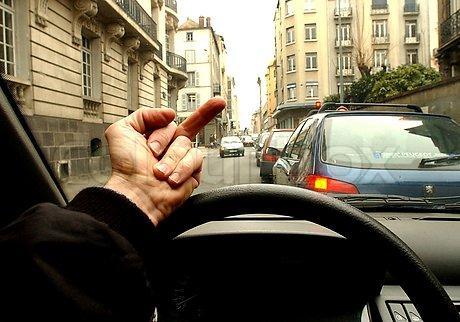 559202-563439-human-hand-showing-middle-finger-from-inside-the-car.jpg